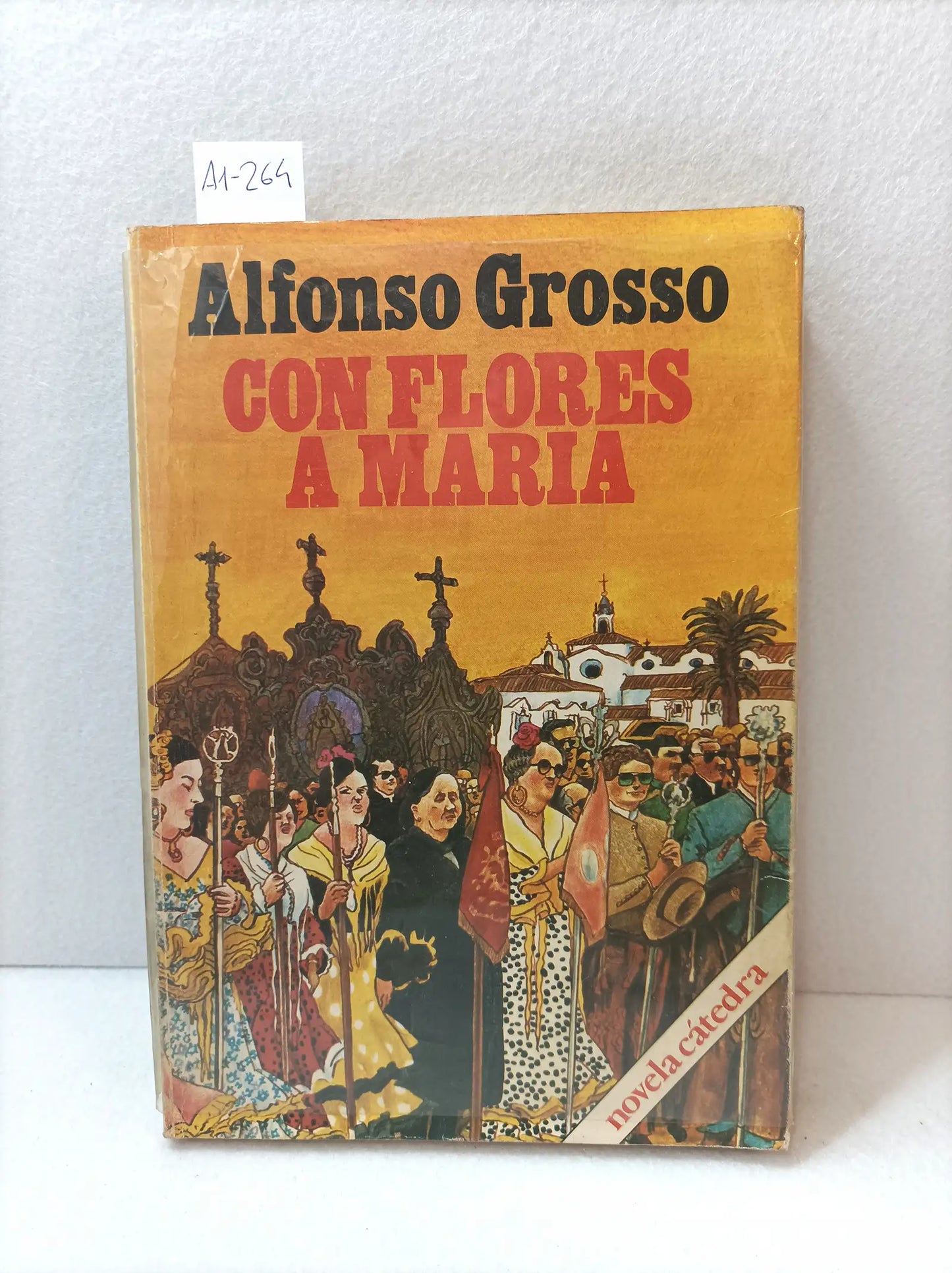 Con flores a María.